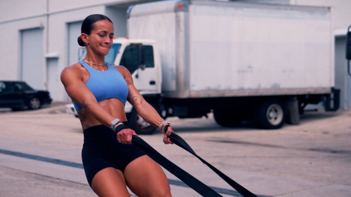Vegan athlete training with resistance straps